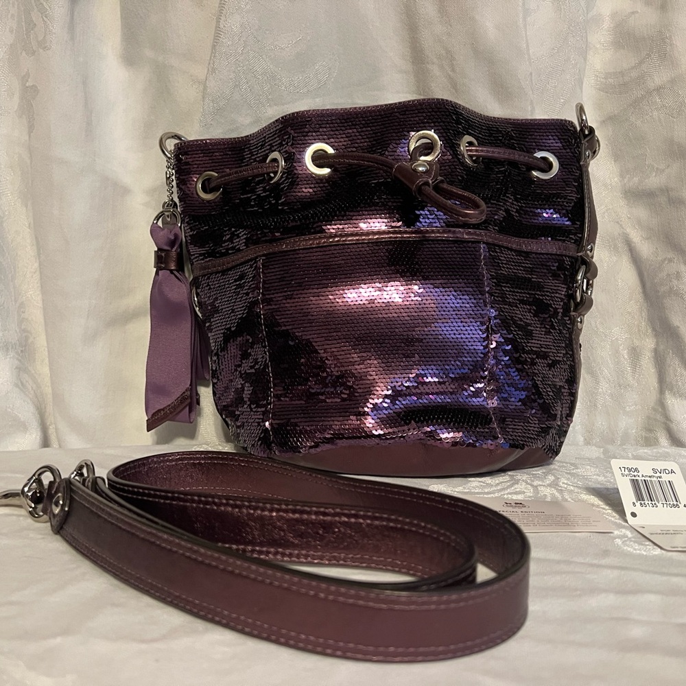 Coach Poppy Sequin satchel in dark amethyst with shimmery leather handles.